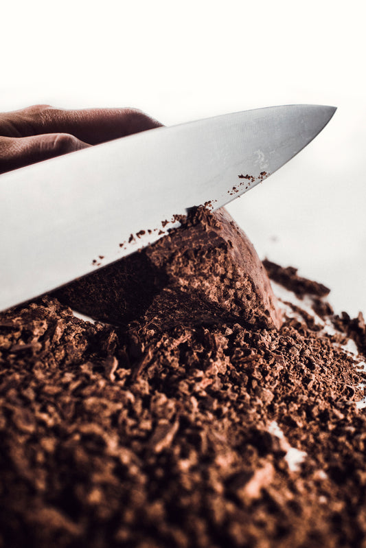 Unwrapped block of artisan Guatemalan cacao paste on white background — showcasing pure texture, origin integrity, and handcrafted quality by Chocolates Sero