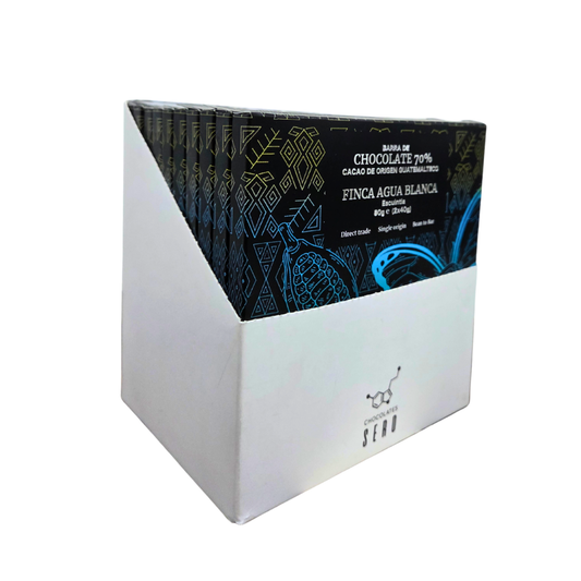Box of 10 Chocolates Sero bars — 80g each, made with 70% single origin cacao from Finca Agua Blanca in Guatemala. Elegant black label design emphasizes artisanal craft and ethical sourcing.