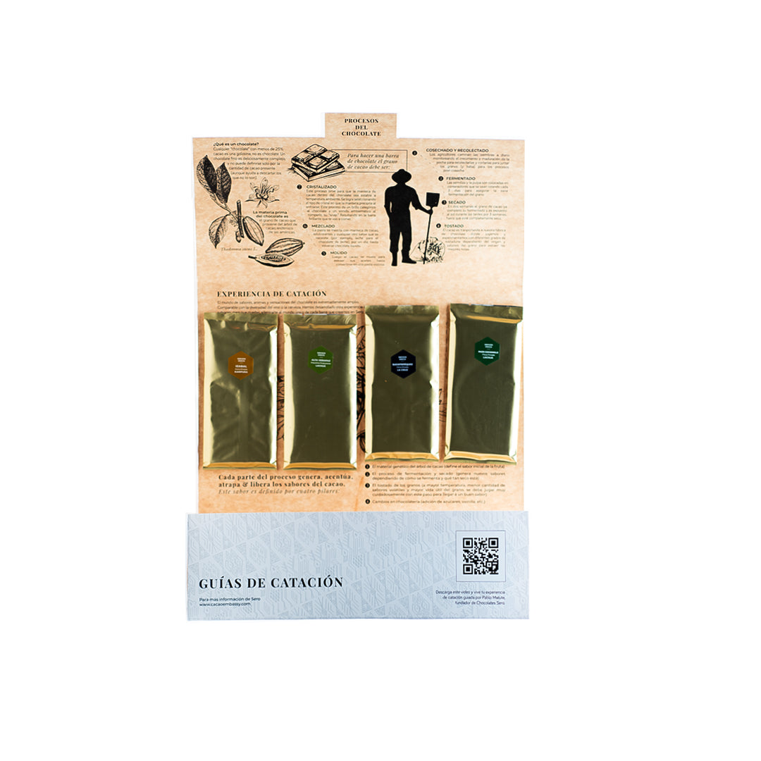 Open Chocolates Sero Tasting Kit displaying four 70% dark chocolate bars from distinct Guatemalan origins, arranged on a printed tasting mat (“mantel de catación”) with a visible QR code linking to a video guide. A curated experience for sensory exploration and ethical storytelling.